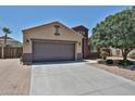 Charming single-story home featuring a two-car garage and desert landscaping at 9437 W Georgia Ave, Glendale, AZ 85305
