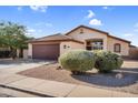 Charming home with manicured landscaping and a tiled roof at 10304 E Plata Ave, Mesa, AZ 85212