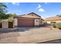 Beautiful single-story home featuring a spacious driveway and a two-car garage at 10304 E Plata Ave, Mesa, AZ 85212