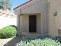Inviting front entrance with a security door and manicured landscaping at 1450 E Laurel Ave, Gilbert, AZ 85234