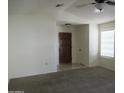 Bright living room featuring neutral paint, new carpet, and a view of the front entrance at 1450 E Laurel Ave, Gilbert, AZ 85234
