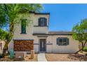Inviting two-story home featuring low maintenance landscaping and a charming brick facade at 14885 W Ashland Ave, Goodyear, AZ 85395