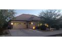 Well-maintained single-story home with a spacious garage and manicured front lawn at 15861 W Westview Dr, Goodyear, AZ 85395