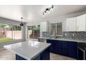 Modern kitchen featuring an island, stainless steel appliances, and stylish cabinetry at 16626 N 20Th St, Phoenix, AZ 85022
