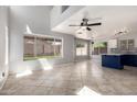 Bright open-concept living area with large windows and tiled flooring, creating a welcoming atmosphere at 16626 N 20Th St, Phoenix, AZ 85022