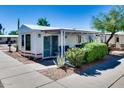 Charming home exterior with a covered patio and well-maintained landscaping at 17200 W Bell Rd # 2162, Surprise, AZ 85374