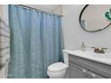 Bathroom featuring subway tile surround, updated vanity, and modern fixtures at 2324 E Crescent Ave, Mesa, AZ 85204