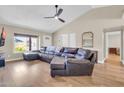 Spacious living room with vaulted ceilings, hardwood floors, and ample natural light at 2324 E Crescent Ave, Mesa, AZ 85204