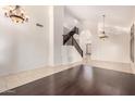 Bright open living room with hardwood accent flooring and a staircase to the second floor at 2741 E San Tan St, Chandler, AZ 85225