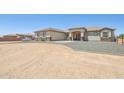 Attractive single-story home featuring a covered entrance and low-maintenance desert landscaping at 28156 N Edwards Rd, San Tan Valley, AZ 85143