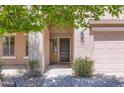 Close-up of the front entrance showing the door and surrounding landscaping at 28806 N 23Rd Ln, Phoenix, AZ 85085