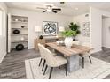 Inviting dining room with modern decor, stylish lighting, and a contemporary dining set at 3114 W Villa Maria Dr, Phoenix, AZ 85053