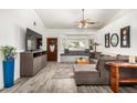 Cozy living room with a large sectional sofa, stylish decor, and plenty of natural light at 4013 E Delta Cir, Mesa, AZ 85206