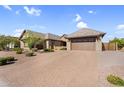 Charming single-story home featuring desert landscaping, a brick paver driveway and a two-car garage at 42161 N Via Cienna --, San Tan Valley, AZ 85140