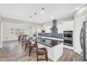 Open concept kitchen featuring a center island, stainless steel appliances, and dining area at 42161 N Via Cienna --, San Tan Valley, AZ 85140