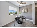 Dining area with modern furnishings, accented wall, and natural light at 616 S Hardy Dr # 203, Tempe, AZ 85281