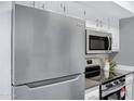Modern kitchen with stainless steel appliances and stylish countertops at 616 S Hardy Dr # 203, Tempe, AZ 85281