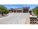 Spacious driveway leading to a home with a three-car garage, perfect for car enthusiasts at 6450 E Monterra Way, Scottsdale, AZ 85266