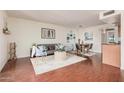 Open living area with wood floors connects the living, dining, and kitchen spaces at 740 W Elm St # 266, Phoenix, AZ 85013