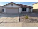 Charming home with well-maintained lawn and attractive curb appeal with desert landscaping at 8254 E Posada Ave, Mesa, AZ 85212