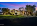 Charming single-story home with manicured lawn, desert landscaping, and covered porch at 9693 N 129Th Pl, Scottsdale, AZ 85259