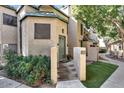 Inviting home exterior featuring landscaped entry, a cozy courtyard, and updated building facade at 101 N 7Th St # 225, Phoenix, AZ 85034