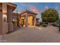 Covered front porch with desert landscaping, enhancing the welcoming feel of the home's facade at 15600 E Robin Dr, Fountain Hills, AZ 85268