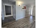 Inviting entryway featuring stylish wood-look tile flooring, and neutral wall paint at 3810 W Yucca St, Phoenix, AZ 85029