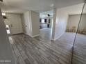 View of open floor plan showing tile flooring and views to a dining area and the kitchen at 3810 W Yucca St, Phoenix, AZ 85029