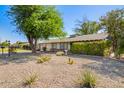 Charming single-story home with a well-maintained front yard and desert landscaping at 48 S Catalina St, Gilbert, AZ 85233