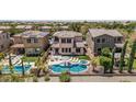 Aerial view of a home with a backyard pool, spa, and well-maintained landscaping at 5051 S Moccasin Trl, Gilbert, AZ 85298