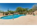 Private backyard pool with lush desert landscaping, perfect for relaxation and entertaining at 6010 E Languid Ln, Carefree, AZ 85377