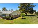 This single-story home boasts a lush backyard, mature trees, and an inviting outdoor space, perfect for relaxation at 631 Leisure World --, Mesa, AZ 85206
