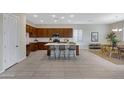 Spacious kitchen with a large island, modern appliances, and ample cabinet space at 8027 W Northview Ave, Glendale, AZ 85303