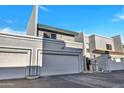 Charming townhome featuring attached garage, well-maintained landscaping, and red tile roof detail at 8619 N 67Th Dr, Peoria, AZ 85345