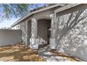 Welcoming front entrance with covered porch and neutral color scheme at 8753 E Plata Ave, Mesa, AZ 85212
