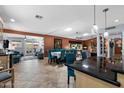 Open-concept living and dining area with tile floors, neutral walls, and a seamless flow at 961 Leisure World --, Mesa, AZ 85206