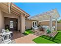 Inviting outdoor patio with pergola, ample seating, and a well-manicured lawn at 961 Leisure World --, Mesa, AZ 85206