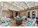 Outdoor patio featuring comfortable seating under a bright pergola, creating an ideal entertaining space at 961 Leisure World --, Mesa, AZ 85206