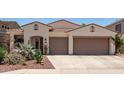 Inviting single-story home featuring desert landscaping and a convenient two-car garage at 10449 E Jacob Ave, Mesa, AZ 85209
