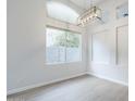 Bright living room featuring a pendant light fixture and neutral walls at 1584 E Harrison E St, Chandler, AZ 85225
