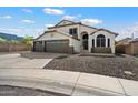 Beautiful two-story home with a three-car garage and well-maintained front yard at 19002 N 25Th Pl, Phoenix, AZ 85050