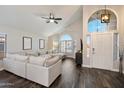 Inviting living room with vaulted ceilings, ample natural light, and stylish wood floors at 19002 N 25Th Pl, Phoenix, AZ 85050