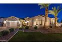 Beautiful single-story home featuring a manicured front yard, desert landscaping, and a three-car garage at 20151 E Via Del Palo St, Queen Creek, AZ 85142
