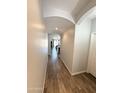 Hallway featuring wood-look tile flooring, leading to the main living areas of the house at 2715 E Canyon Creek Dr, Gilbert, AZ 85295