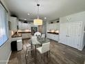 Bright eat-in kitchen features a glass table with seating and modern cabinetry at 2715 E Canyon Creek Dr, Gilbert, AZ 85295