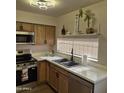 Functional kitchen featuring modern appliances, double sink, and plenty of counter space at 2946 N 14Th N St # 14, Phoenix, AZ 85014