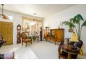 Bright living room featuring large windows, plantation shutters, and elegant decor at 316 W Anderson Ave, Phoenix, AZ 85023