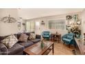 Inviting living room features stylish decor, a cozy couch, and plenty of natural light at 8532 E Portland St, Scottsdale, AZ 85257