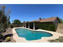 View of a private backyard pool with desert landscaping and ample deck space at 9402 N 48Th Dr, Glendale, AZ 85302
